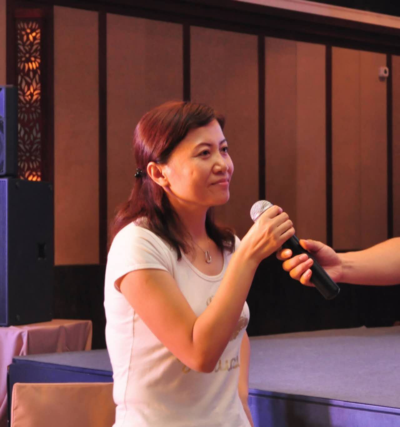 May Yuan speaking at an event